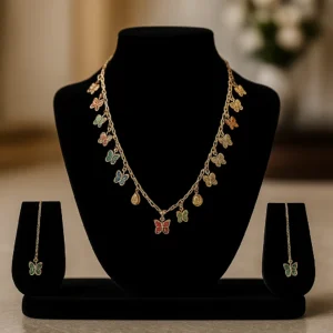 Artificial gold butterfly necklace with colorful charms – close-up view