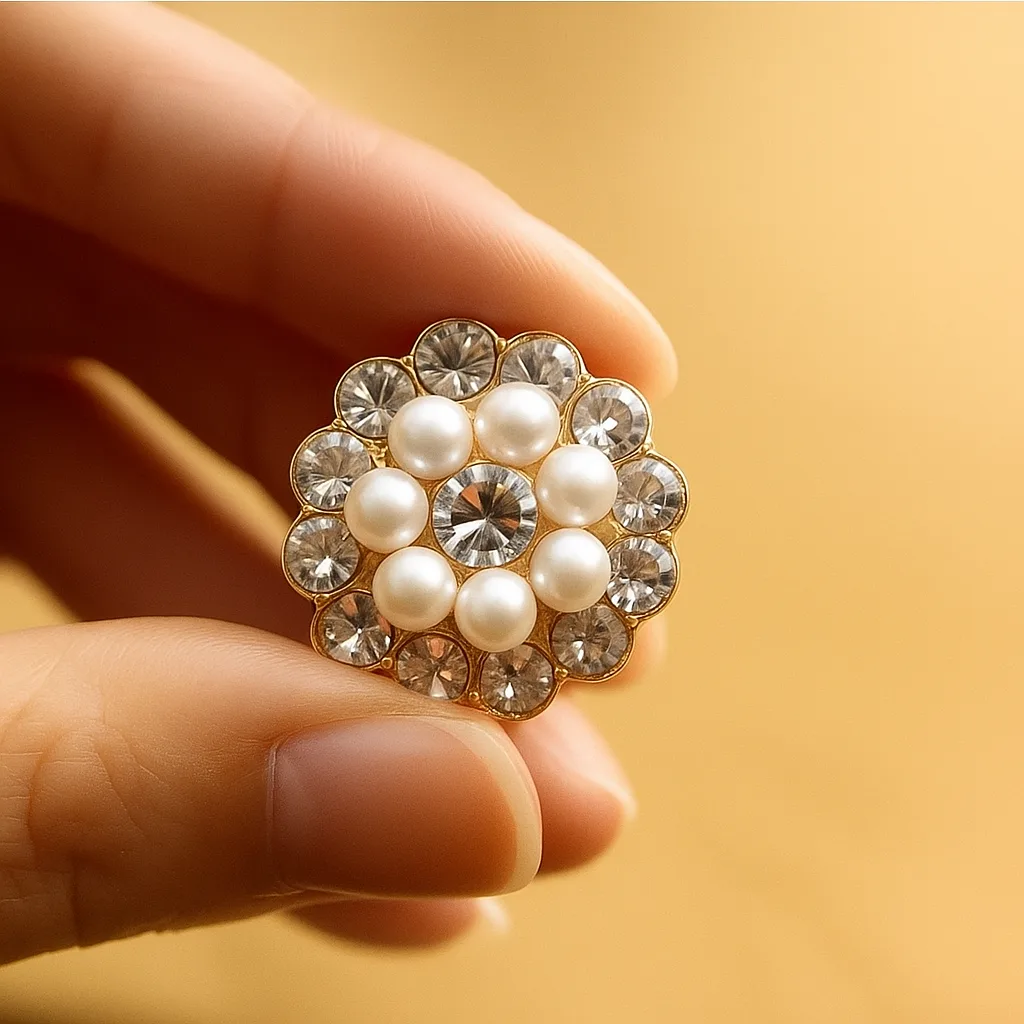 Side angle view of pearl and crystal floral statement ring in gold finish for bridal and festive looks