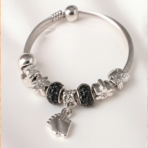 Silver Charm Bracelet with Black Beads and Footprint Pendant – Close-up