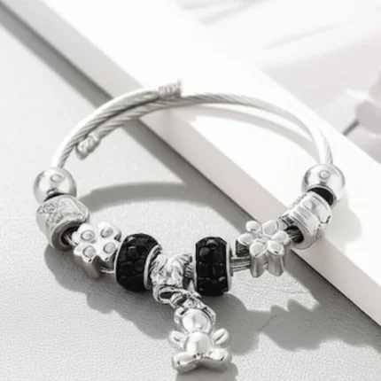 eddy Bear Charm Silver Bracelet Full view of Teddy Bear Charm Silver Bracelet with beads and floral accents