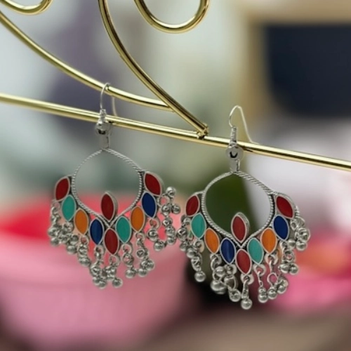 Side profile of multicolor oxidized bohemian jhumka earrings with dangling beads
