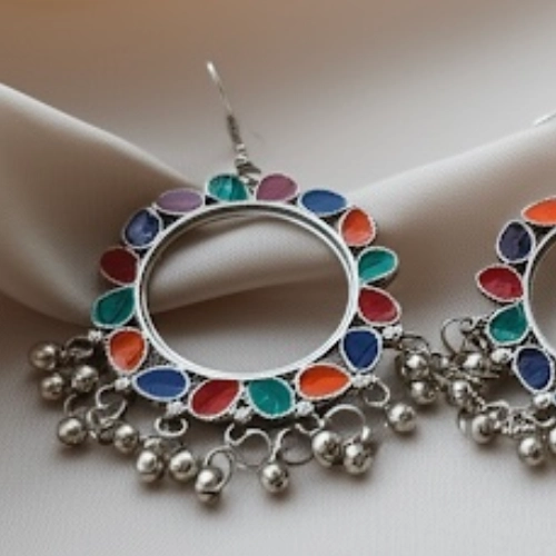 Colorful oxidized hoop earrings with multicolor enamel accents and beaded danglers front view