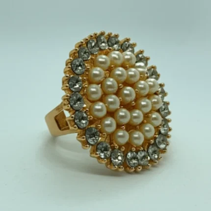 Front view of grand crystal and pearl cluster statement ring in gold finish